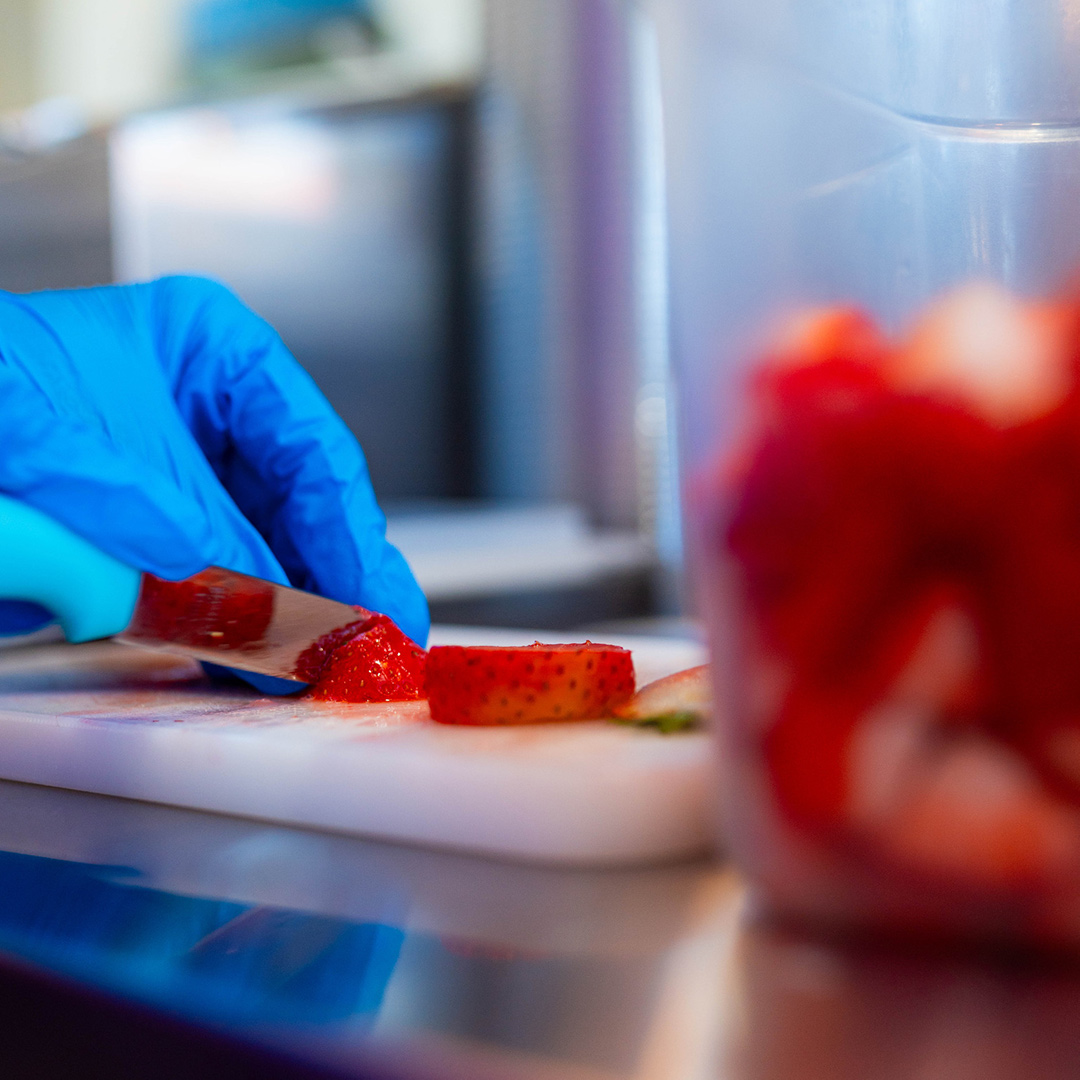Fresh strawberries being sliced in Louisville, Kentucky.